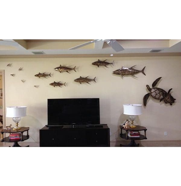 A living room with fish on the wall